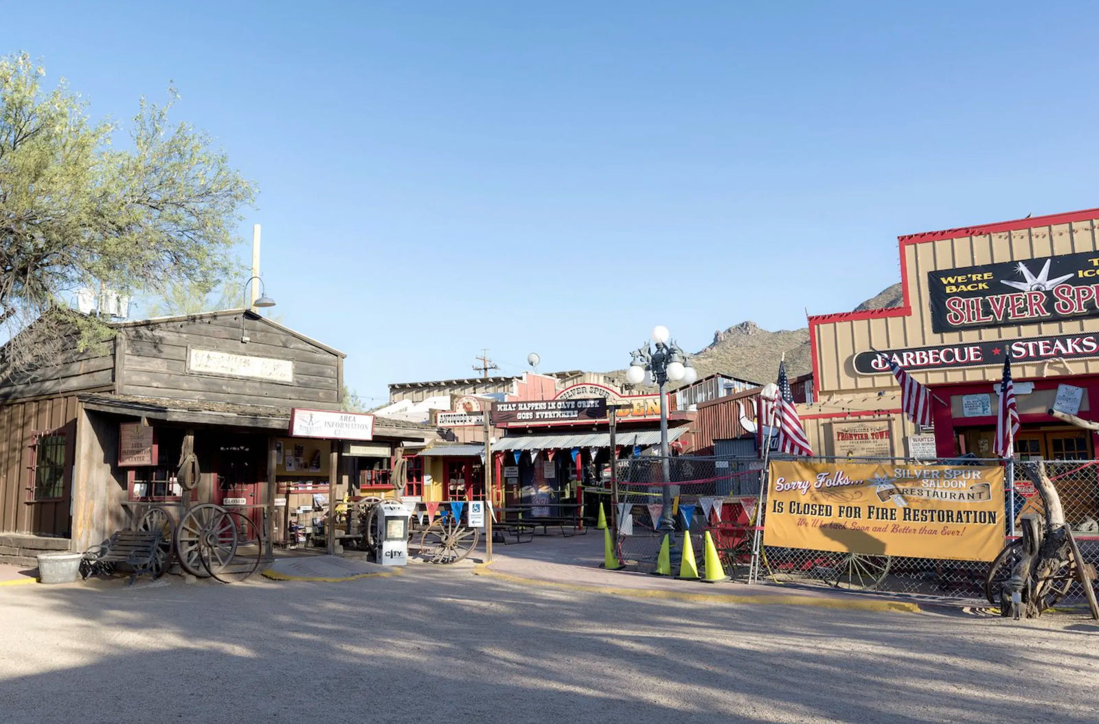 Rustic wooden buildings of Frontier Town, a historic attraction in Cave Creek AZ near Rare Earth Gallery