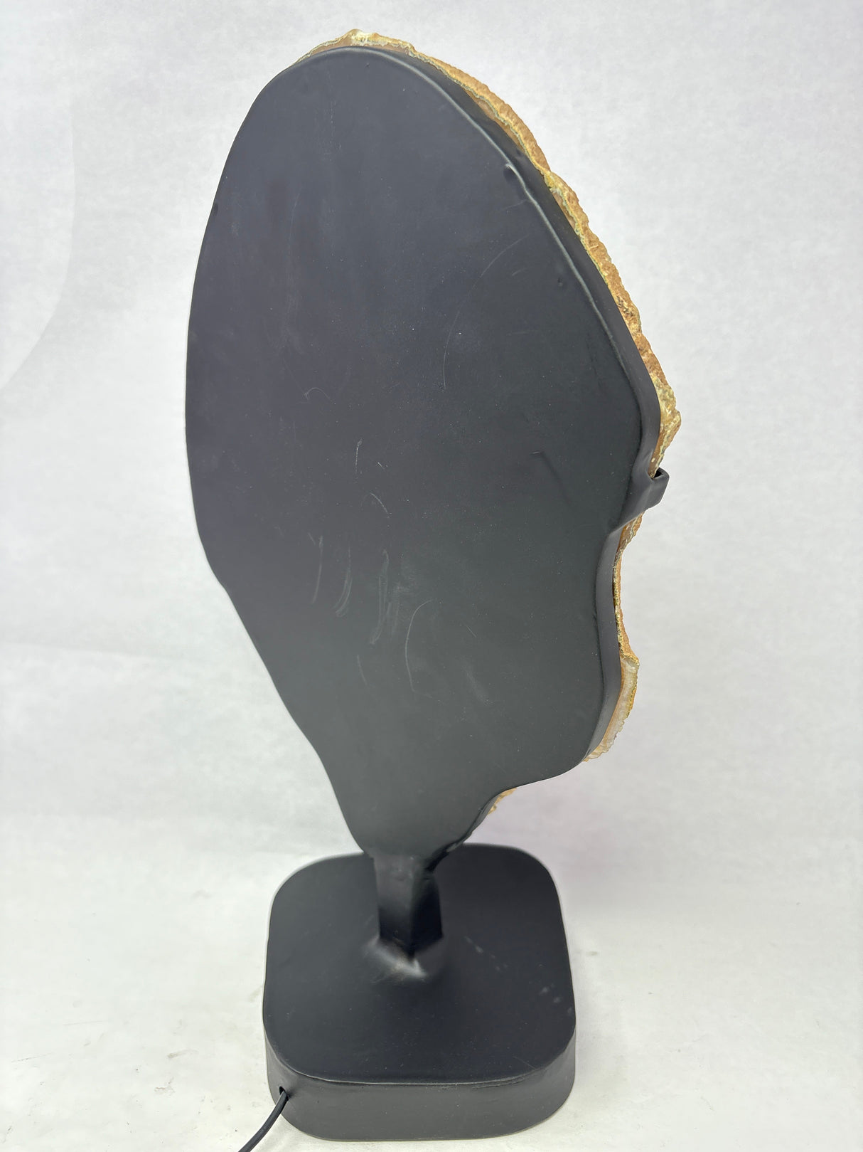 Chocolate Agate Slice with Amethyst Center On Illuminated Table Stand