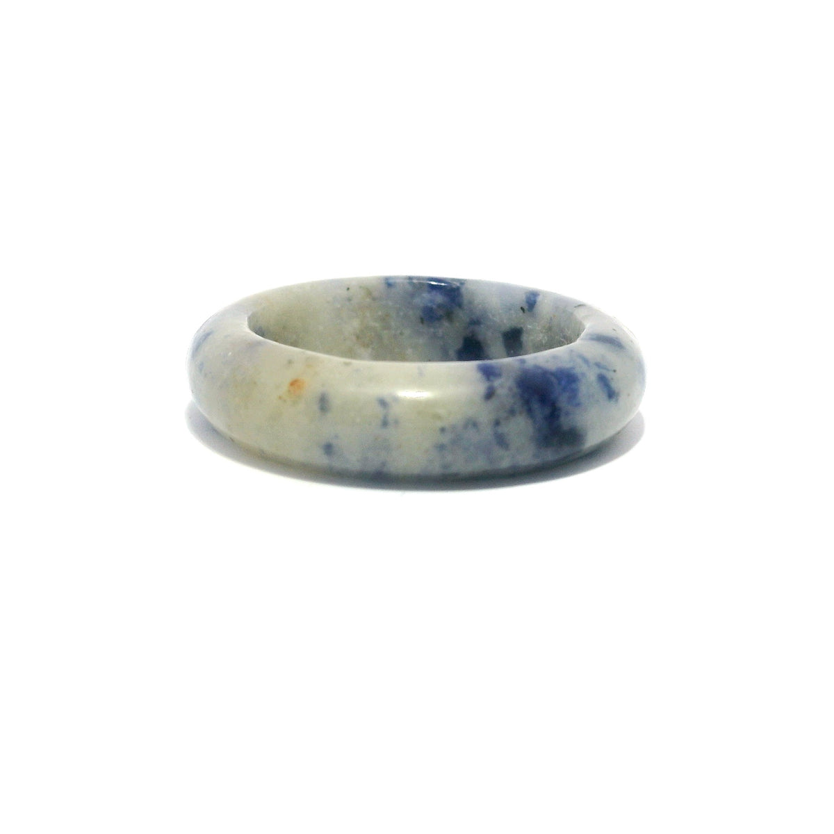 Sodalite gemstone band ring in pale grey-blue with scattered blue flecks, carved from solid stone