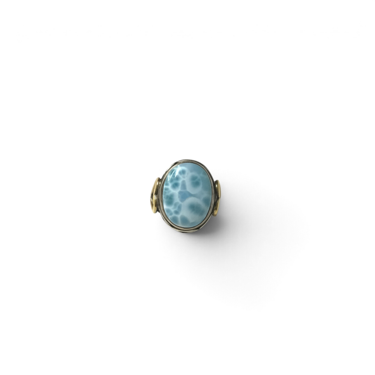 Rare Earth Gallery oval larimar cabochon ring with a silver braided bezel and gold heart detail on an oxidized band.
