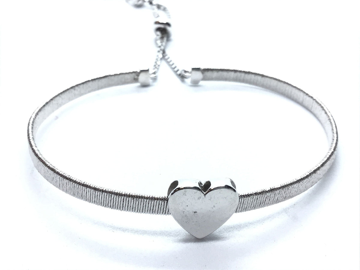 White gold plated mesh bracelet with polished heart centerpiece, adjustable
