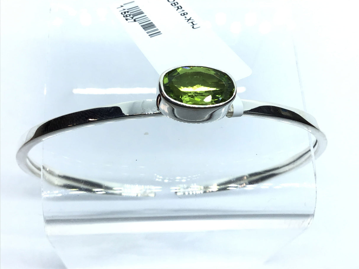 View of Faceted Peridot Twist Bracelet - East-west Set Oval With Tall Silver Bezel
