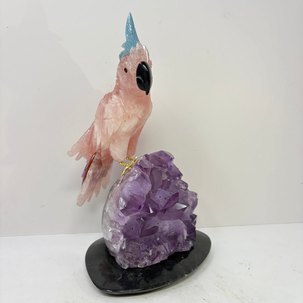 Rose Quartz Cockatoo Carving with Blue Quartz Crest Perched on Amethyst Crystal Cluster with Black Marble Base