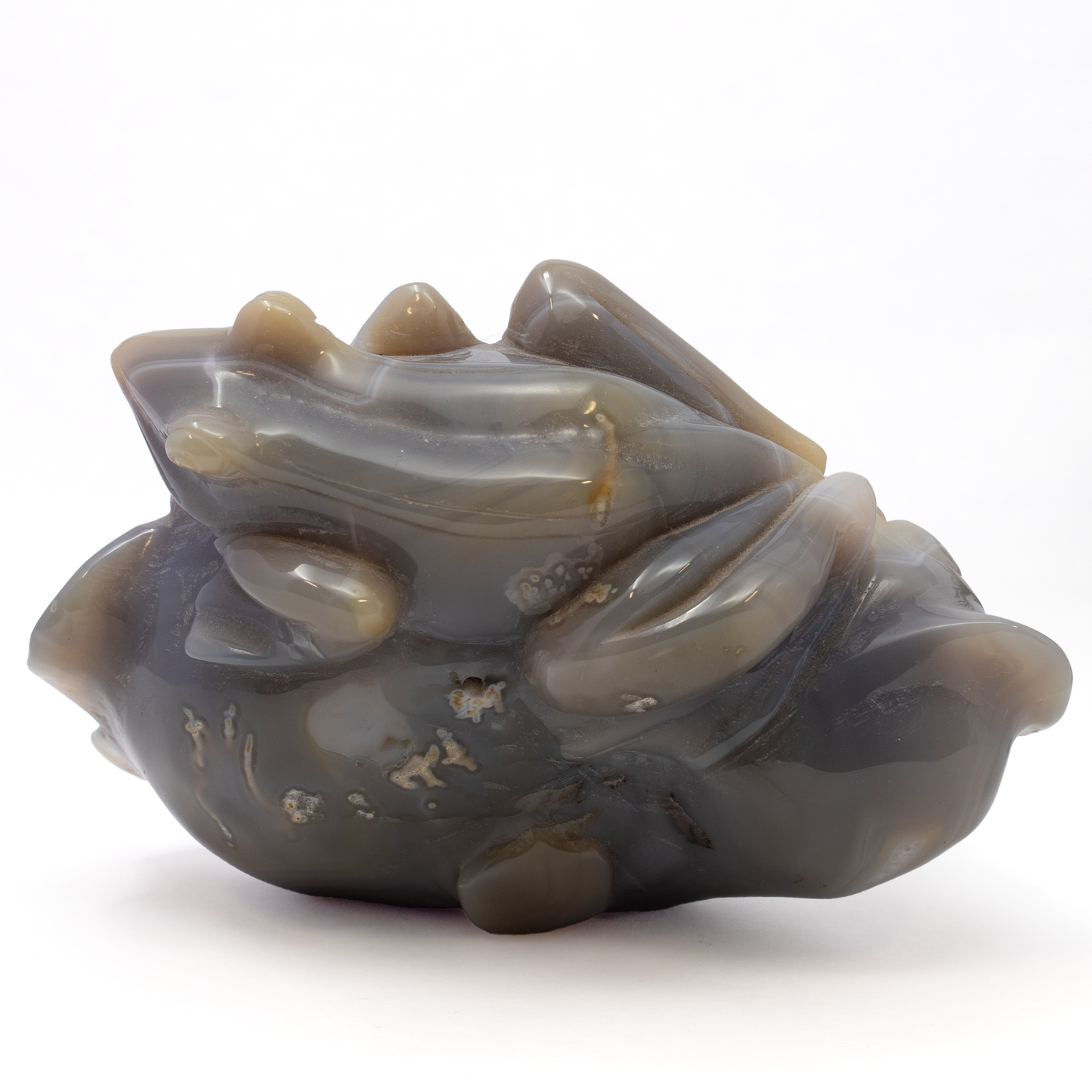 View of Agate Geode Frog Carving On A Boulder - Scalloped Edges And Rose Defrance