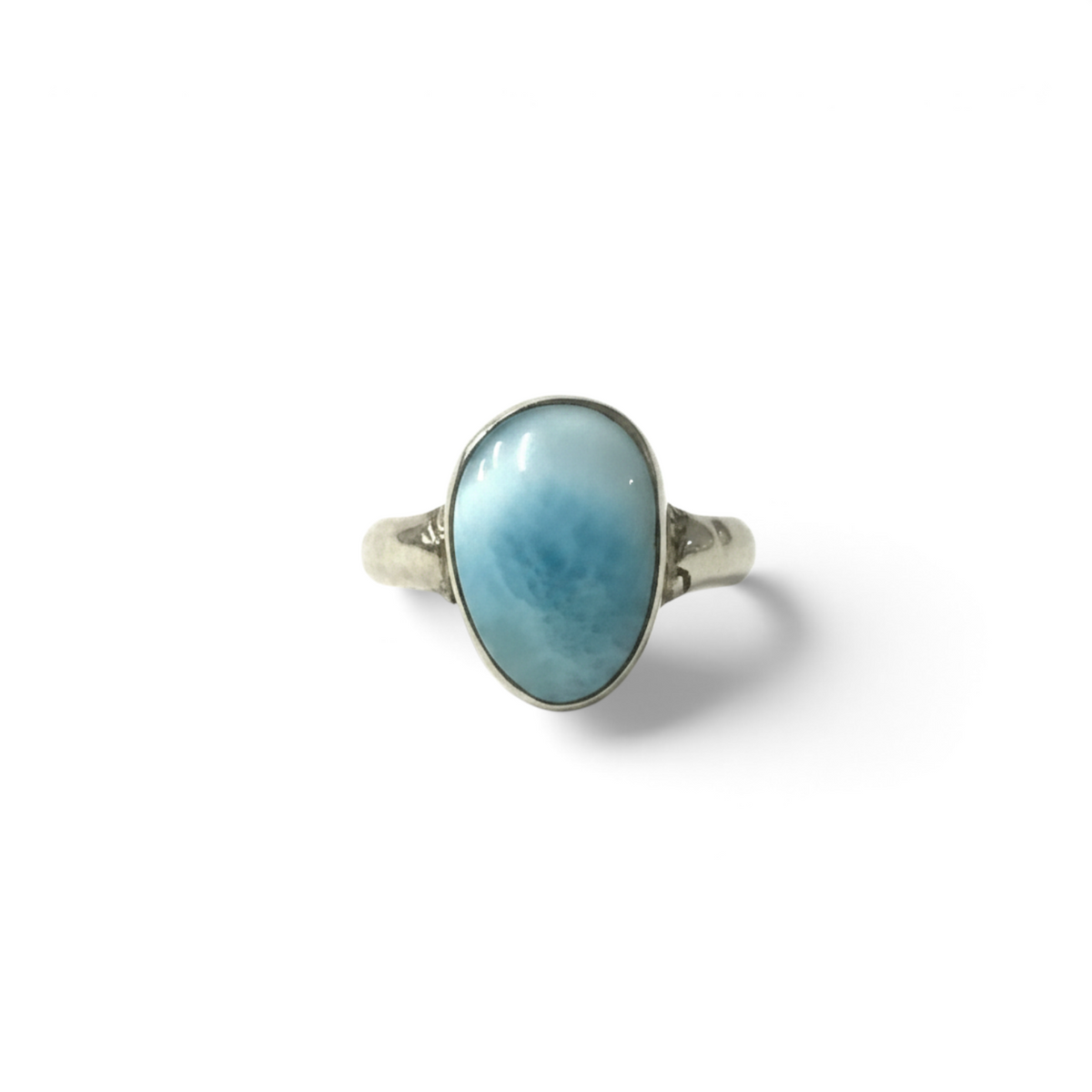 Rare Earth Gallery larimar ring featuring a small freeform blue cabochon stone set on a hammered silver band