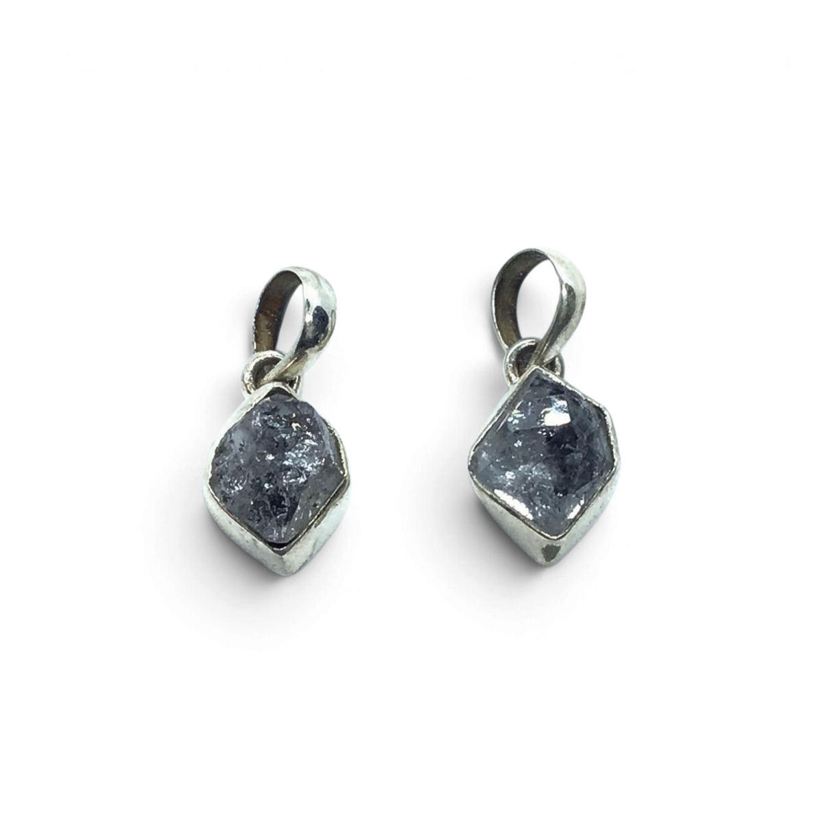 Rare Earth Gallery double-terminated Herkimer Diamond crystal pendants set in polished silver settings.