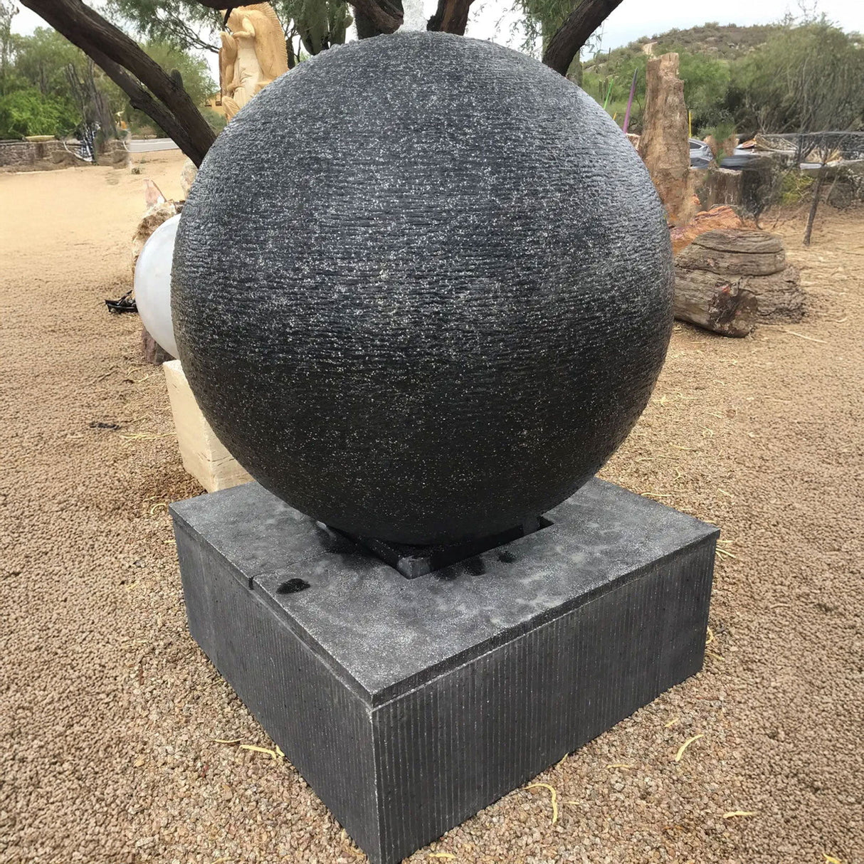 View of 44\" Diameter Black Cast Concrete Sphere Fountain - Large