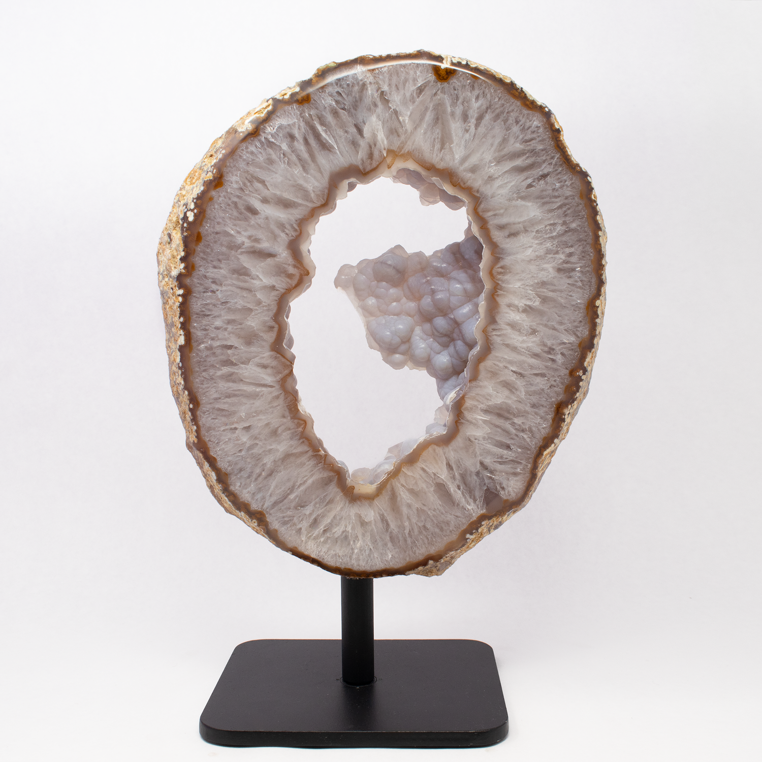 View of Rose De France with Carnelian Agate Geode Ring on Fitted Rotating Stand with Botryoidal Agate Pie in Center