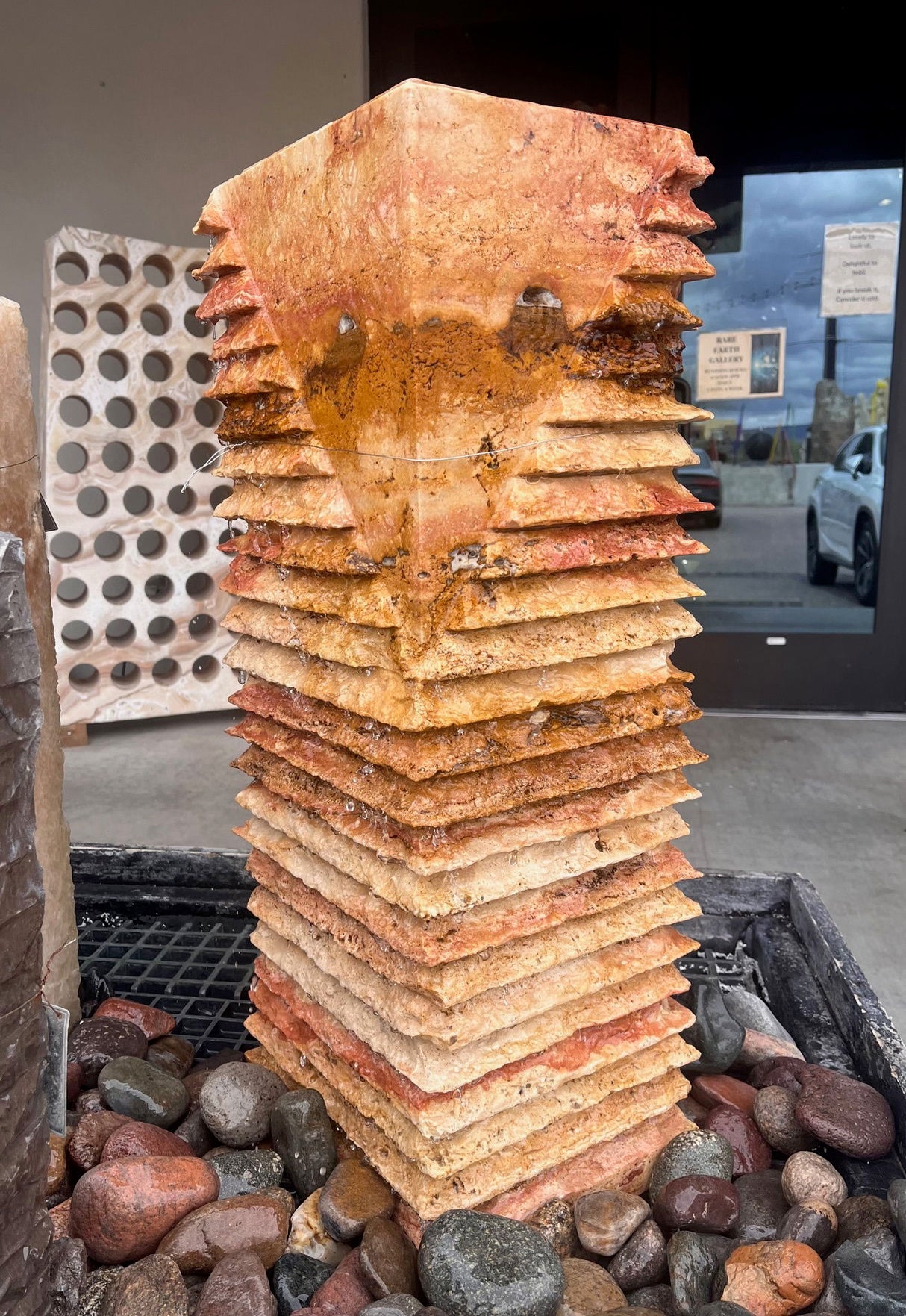 View of Red Travertine Fountain - Chiseled Pillar