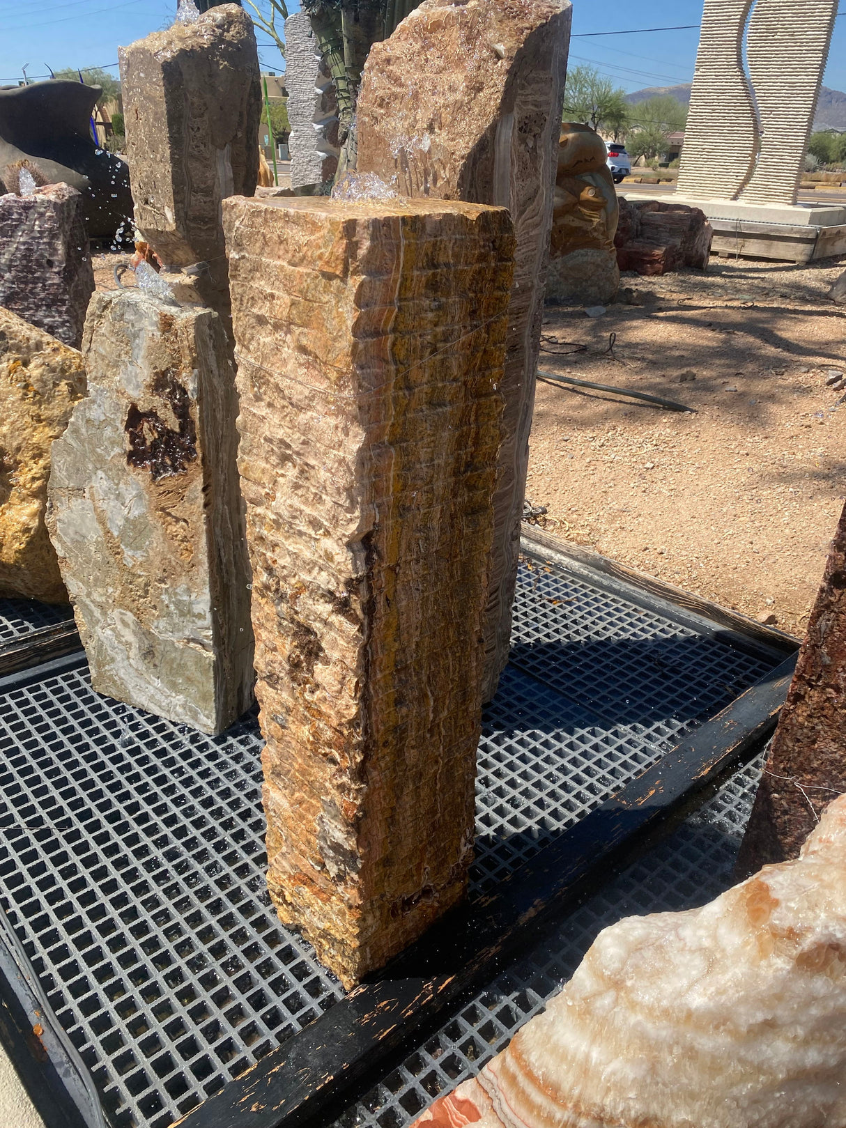 View of Chiseled Travertine Column Fountain
