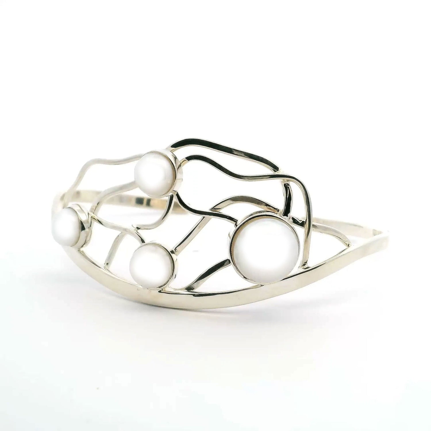 View of Freshwater Pearl Cuff - 4 Round Pearls Bezel Set in 925 Sterling Silver on Curved Cuff with Wavy Lines