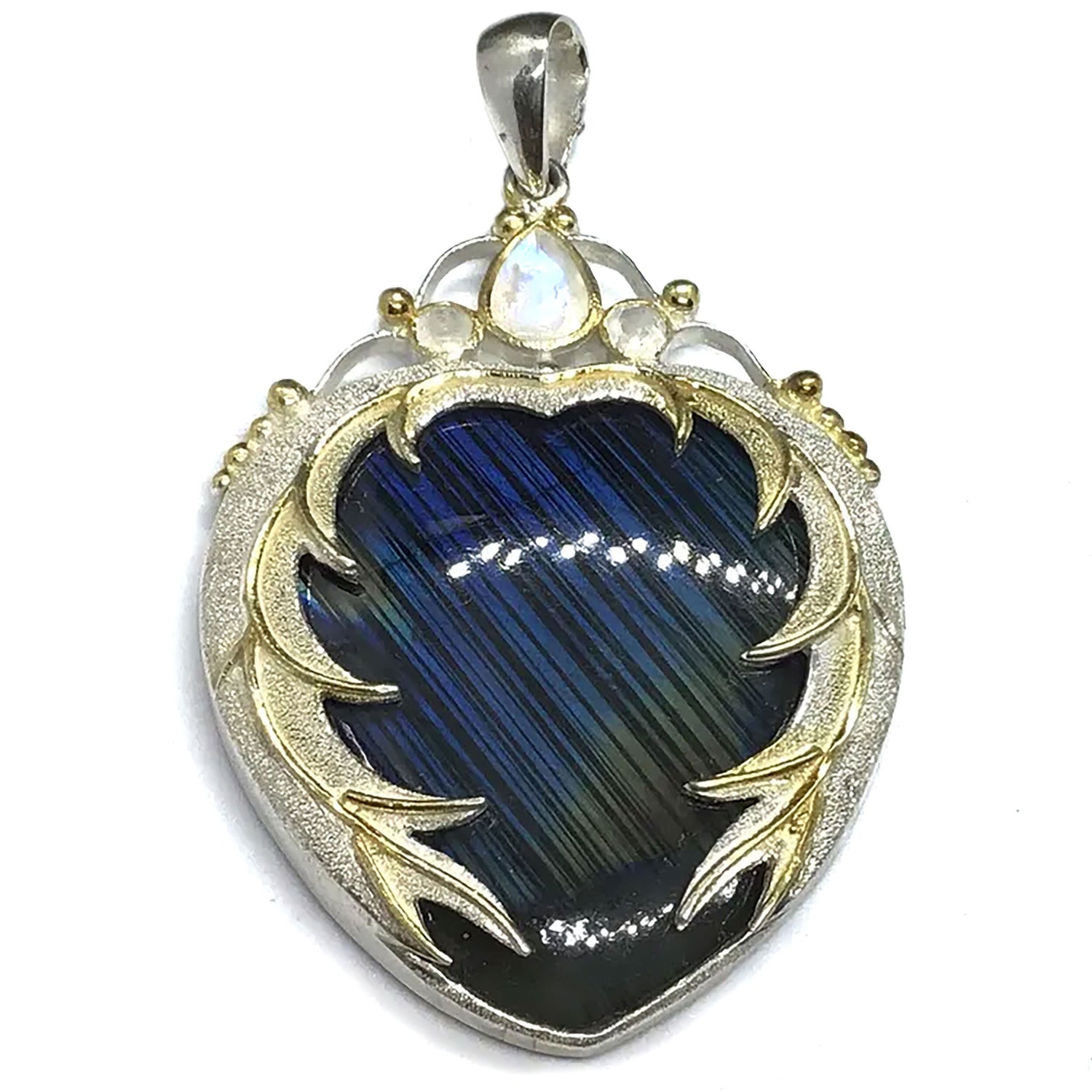 View of Labradorite Pendant - Blue with Yellow Flash Cabochon Bezel Set in 925 Sterling Silver Sandblasted Heart Setting with Gold Plating & Faceted Moonstones Above