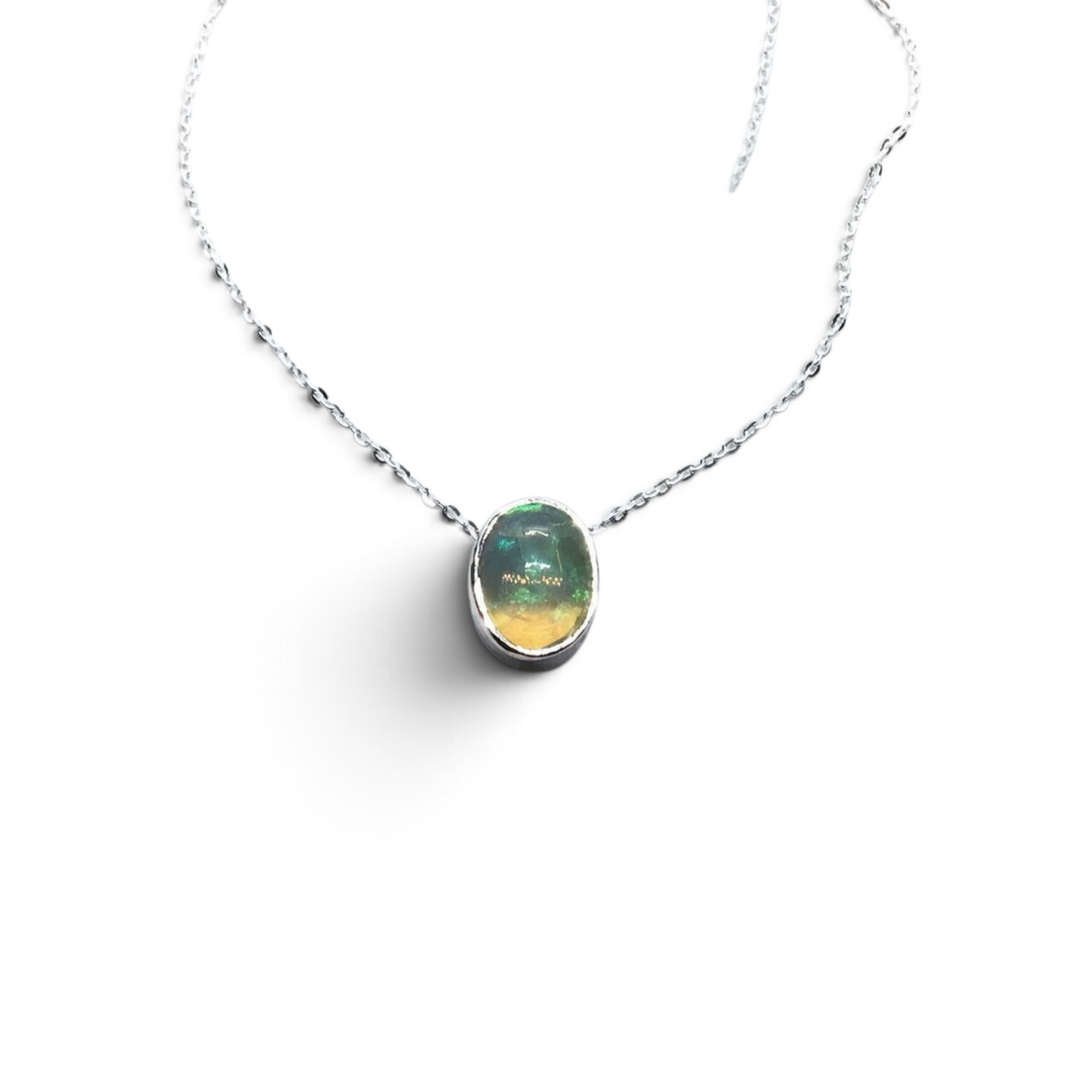 Rare Earth Gallery oval Ethiopian opal cabochon necklace in a 925 sterling silver slider bezel with an 18-inch chain.