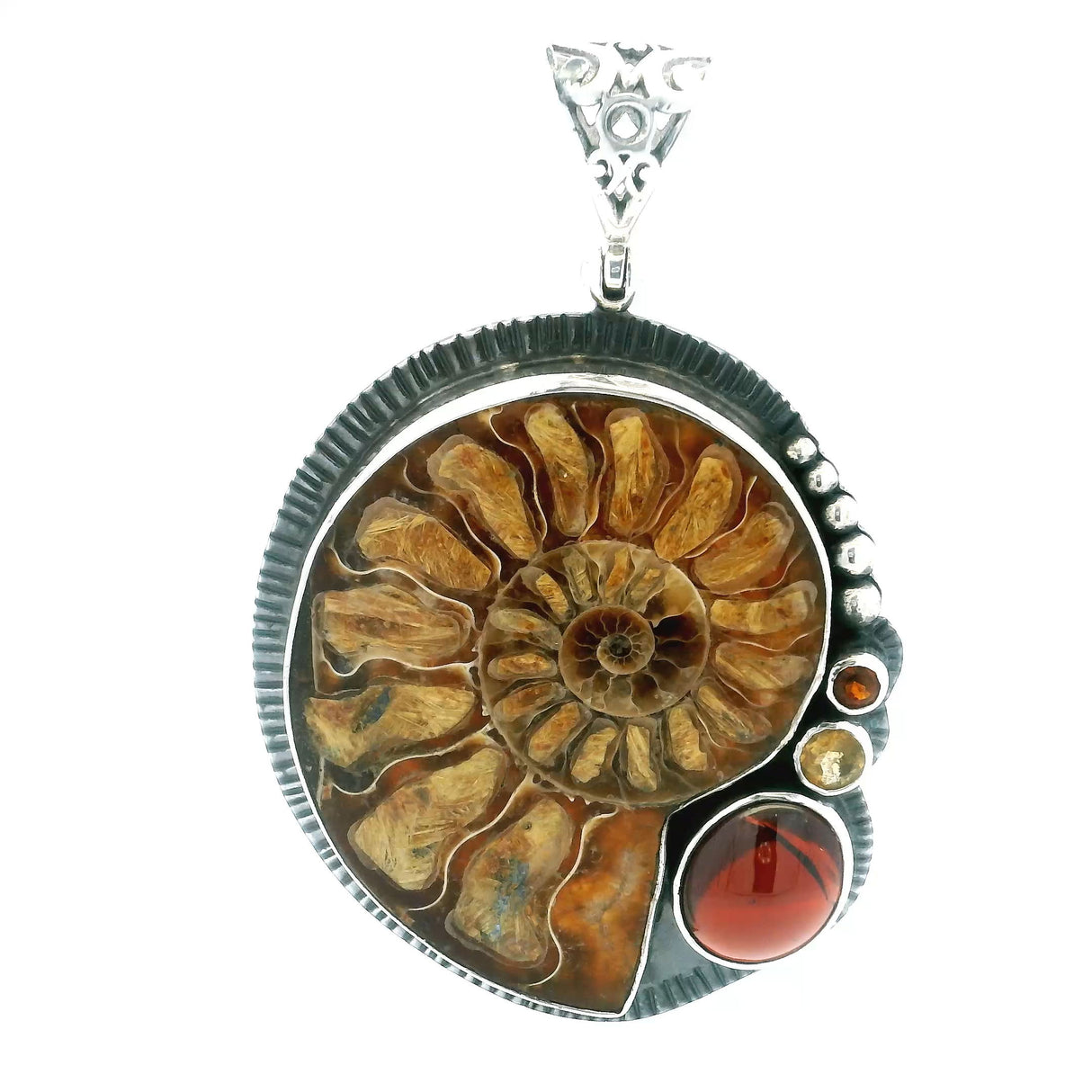 View of Ammonite Fossil Pendant - Open Inverted Ammonite Cross-section Inlaid with Rutilated Quartz with Oval Garnet Cabochon & Faceted Garnet & Citrine Rounds Bezel Set in 925 Sterling Silver