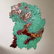 Copper splash with green and brown textures on a white background