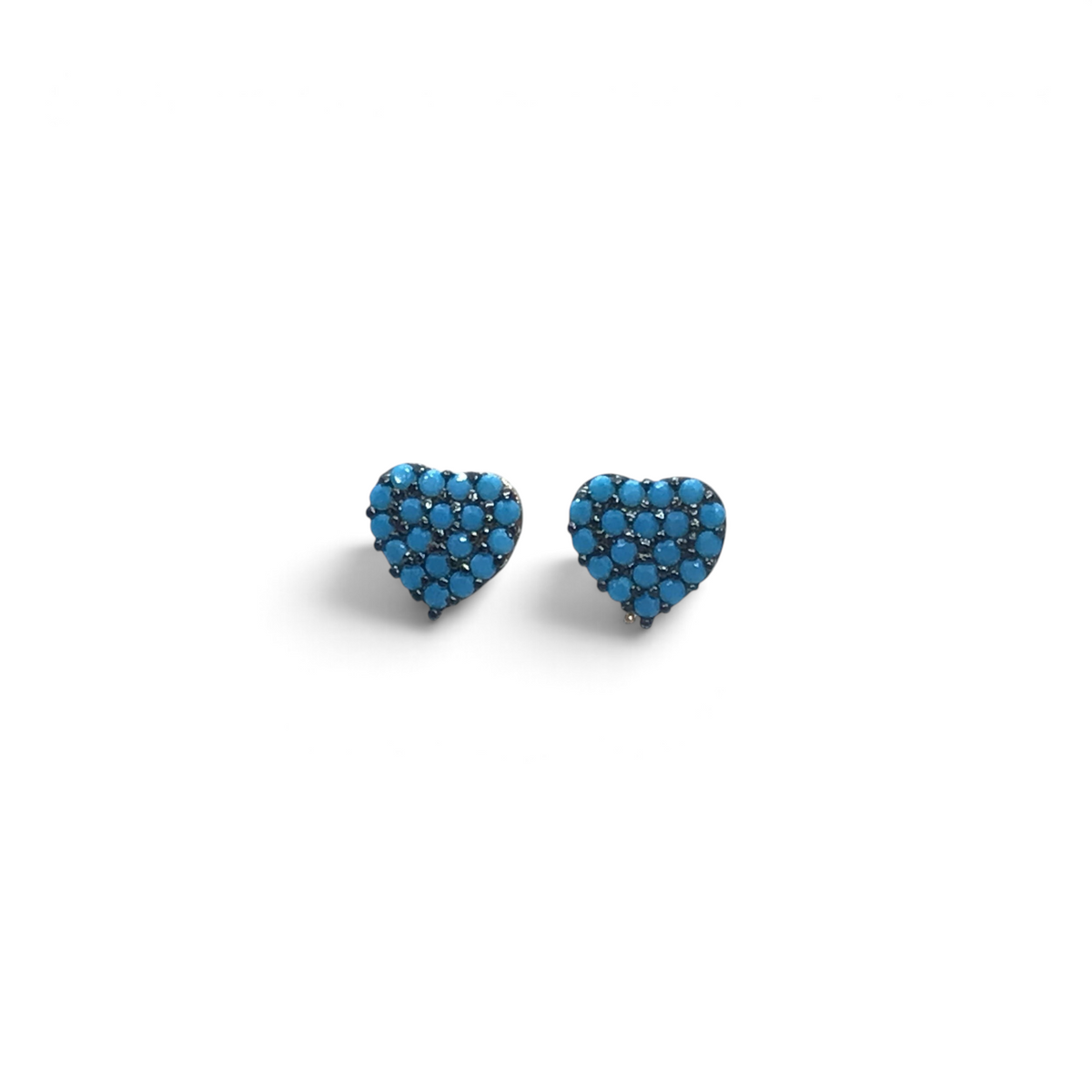 Turquoise pave heart stud earrings on a white backdrop