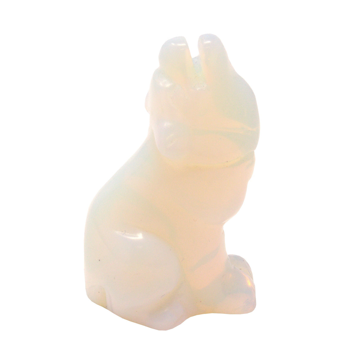 Opalite carved sitting wolf in milky white stone with a soft translucent glow