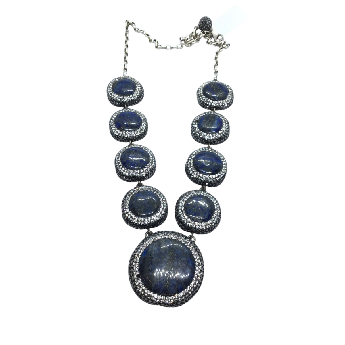 Graduated blue lapis lazuli cabochons haloed with marcasite and Swarovski crystal pave on silver chain