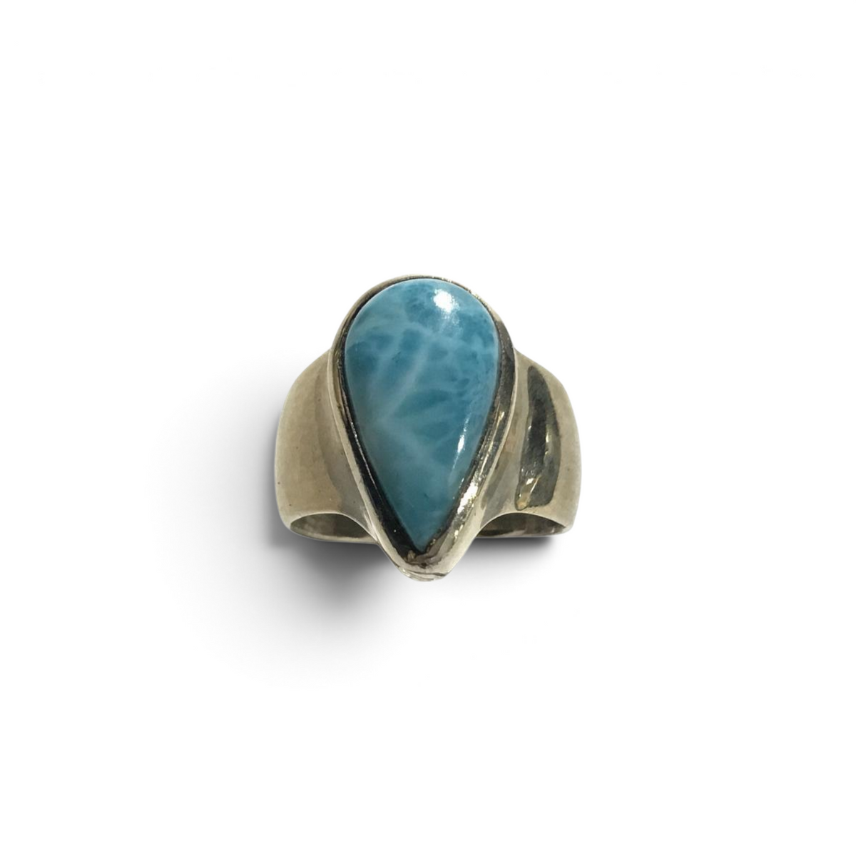 Rare Earth Gallery pear-shaped larimar cabochon ring with a raised bezel and wide silver band.