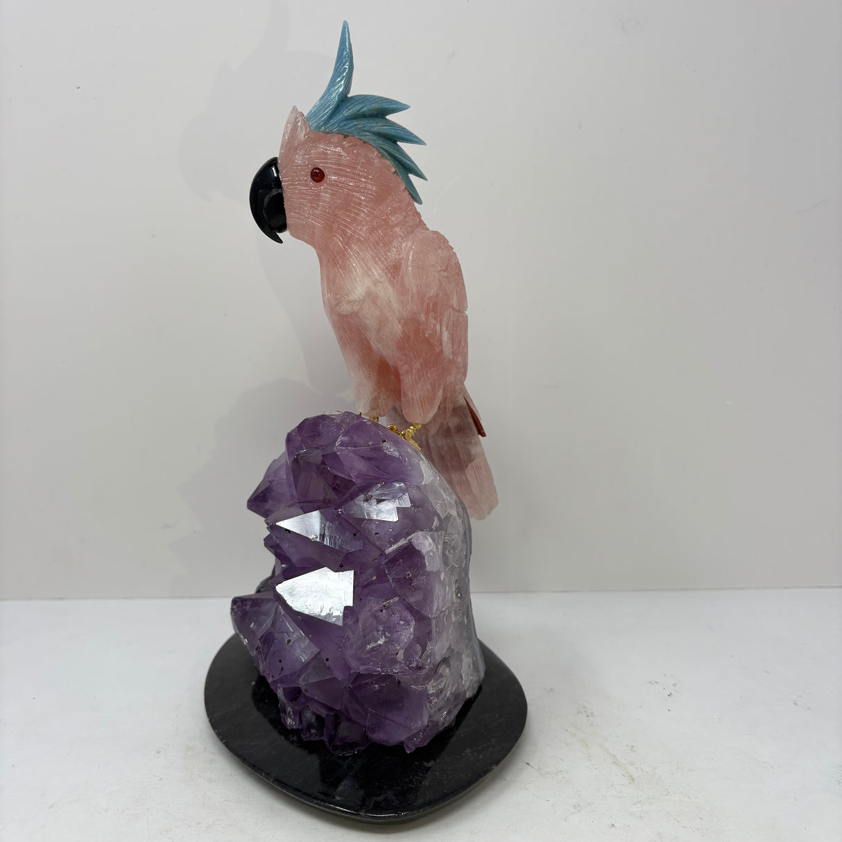Rose Quartz Cockatoo Carving with Blue Quartz Crest Perched on Amethyst Crystal Cluster with Black Marble Base