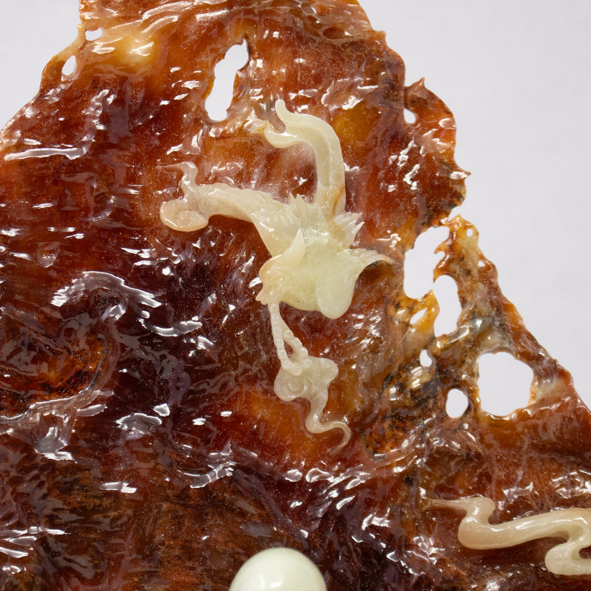 Green Jade Buddha Sculpture Sitting on Brown Jade Relieved Back Drop