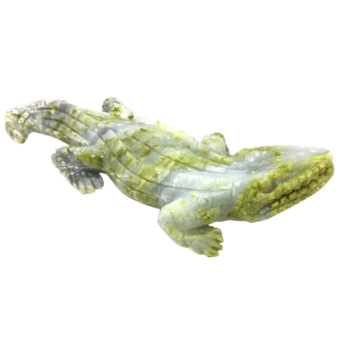 Crystal crocodile figurine on a white background