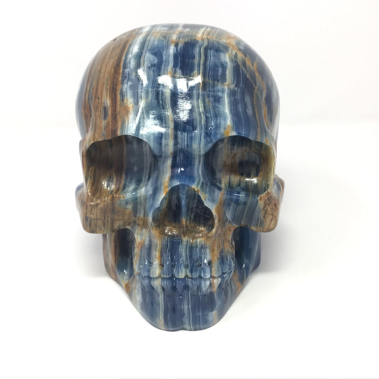 Blue Calcite Skull Carving with Woody Grains on Right Side