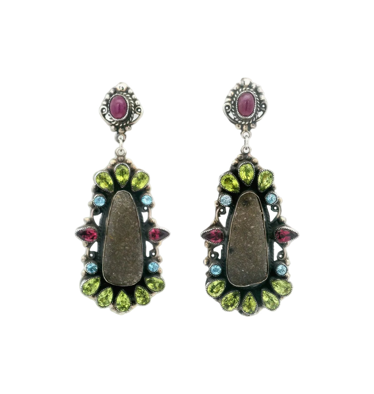 Pair of earrings with gemstones on a white background
