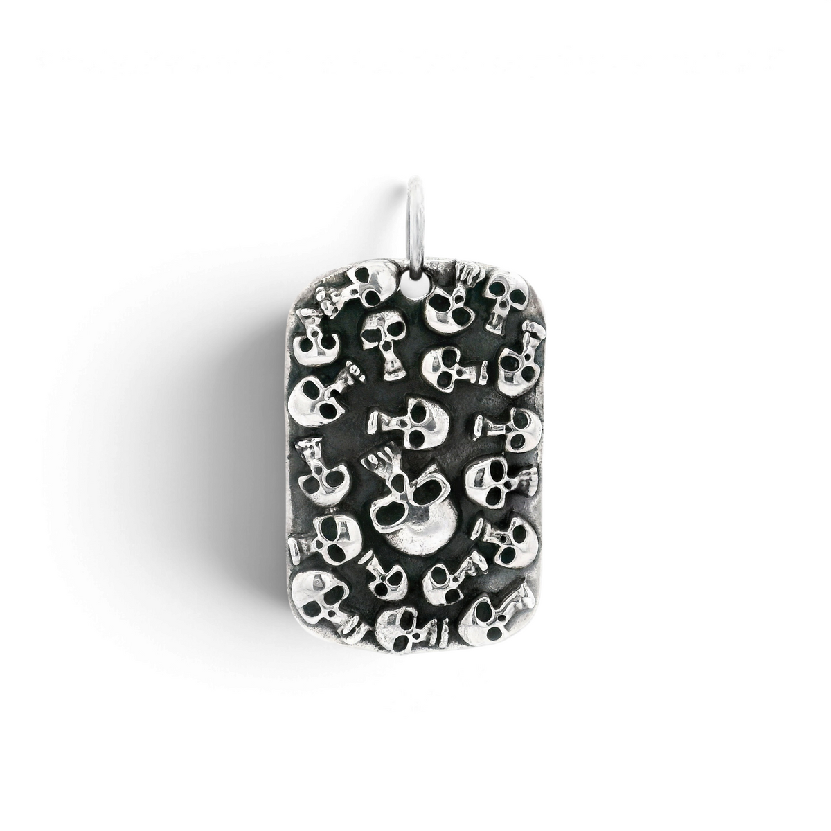 Sterling silver dog tag pendant covered in clustered oxidized skulls