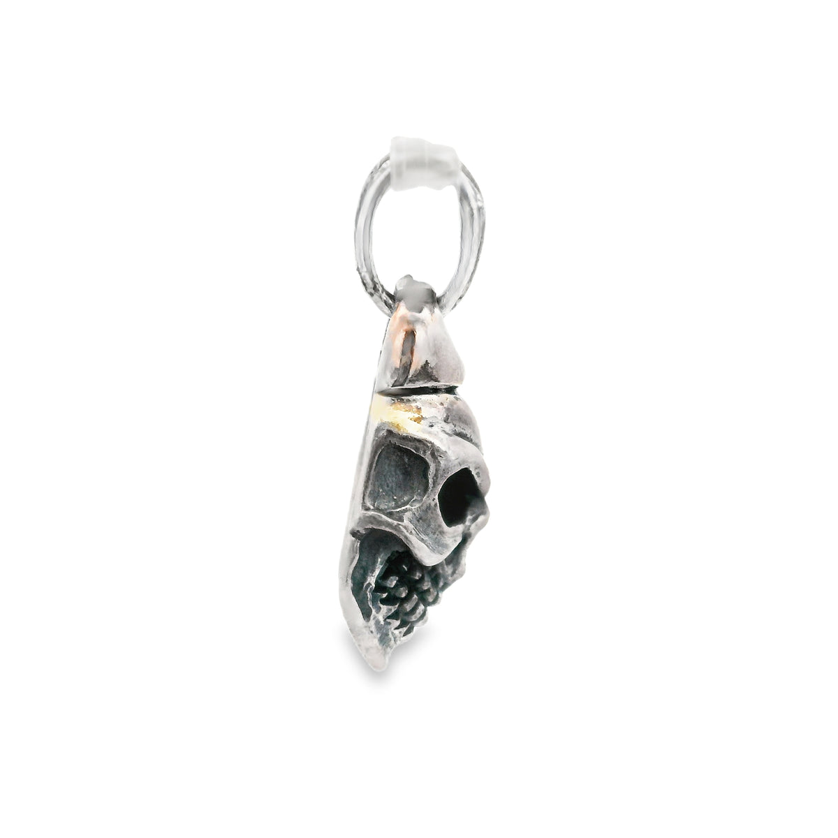 Sterling silver skull pendant, side profile view with flat back