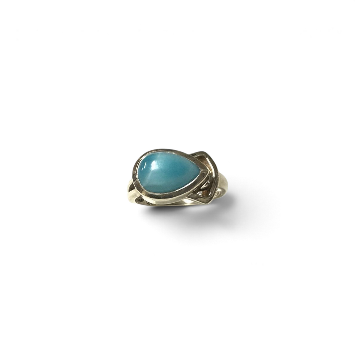 Rare Earth Gallery pear-shaped Larimar cabochon ring set east-west in a silver band with a unique side cutout design.