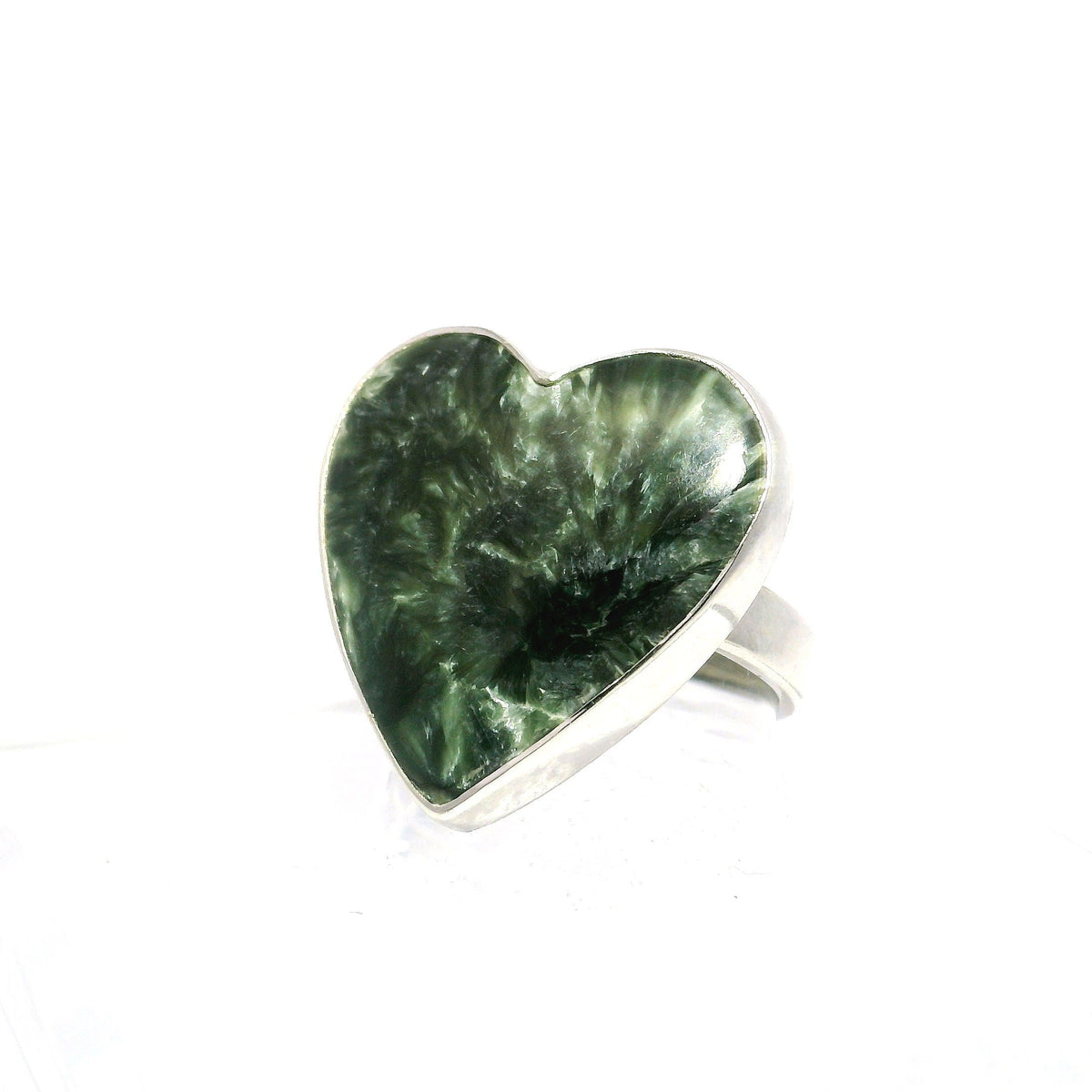 Green seraphinite heart cabochon with feathery silver chatoyance, bezel set