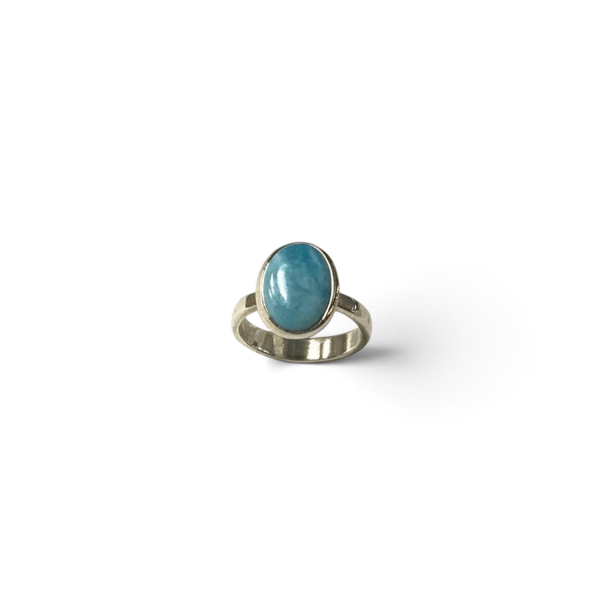 Rare Earth Gallery Larimar ring featuring a simple oval cabochon stone set in a raised silver bezel.