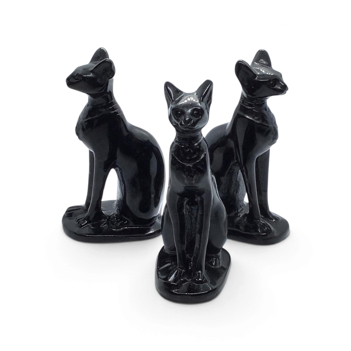 Rare Earth Gallery black obsidian Sphynx cat carvings in a set of three polished stone figurines.