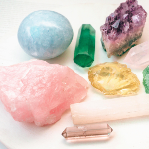 Collection of colorful crystals and gemstones on a white background