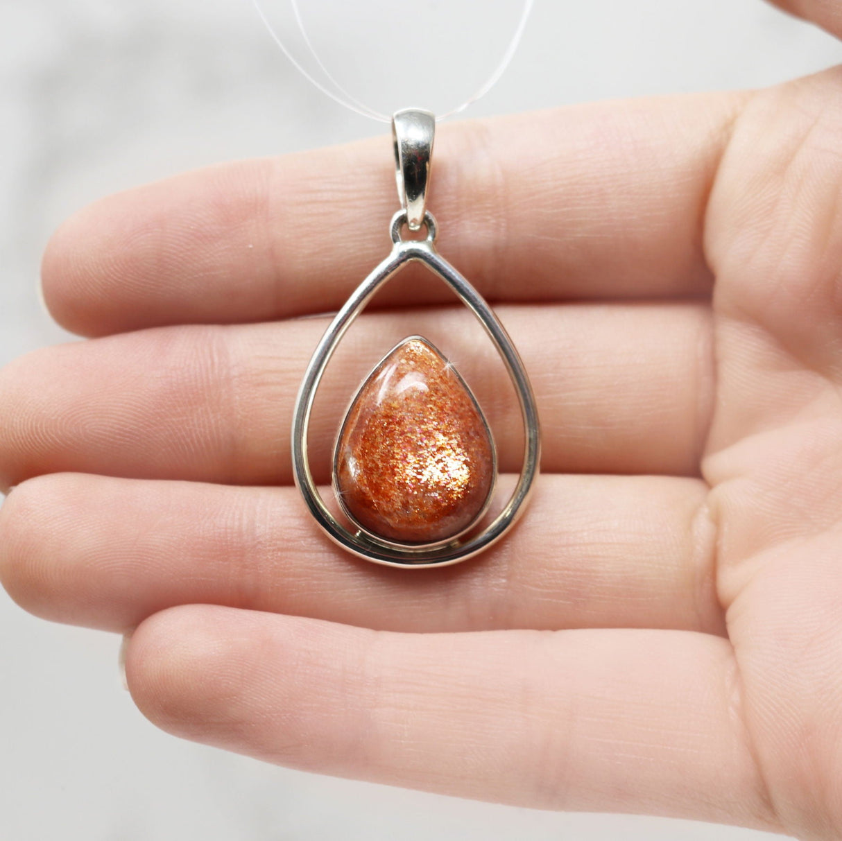 Sunstone Pendant - Pear Cabochon Set in Open Sterling Silver Frame