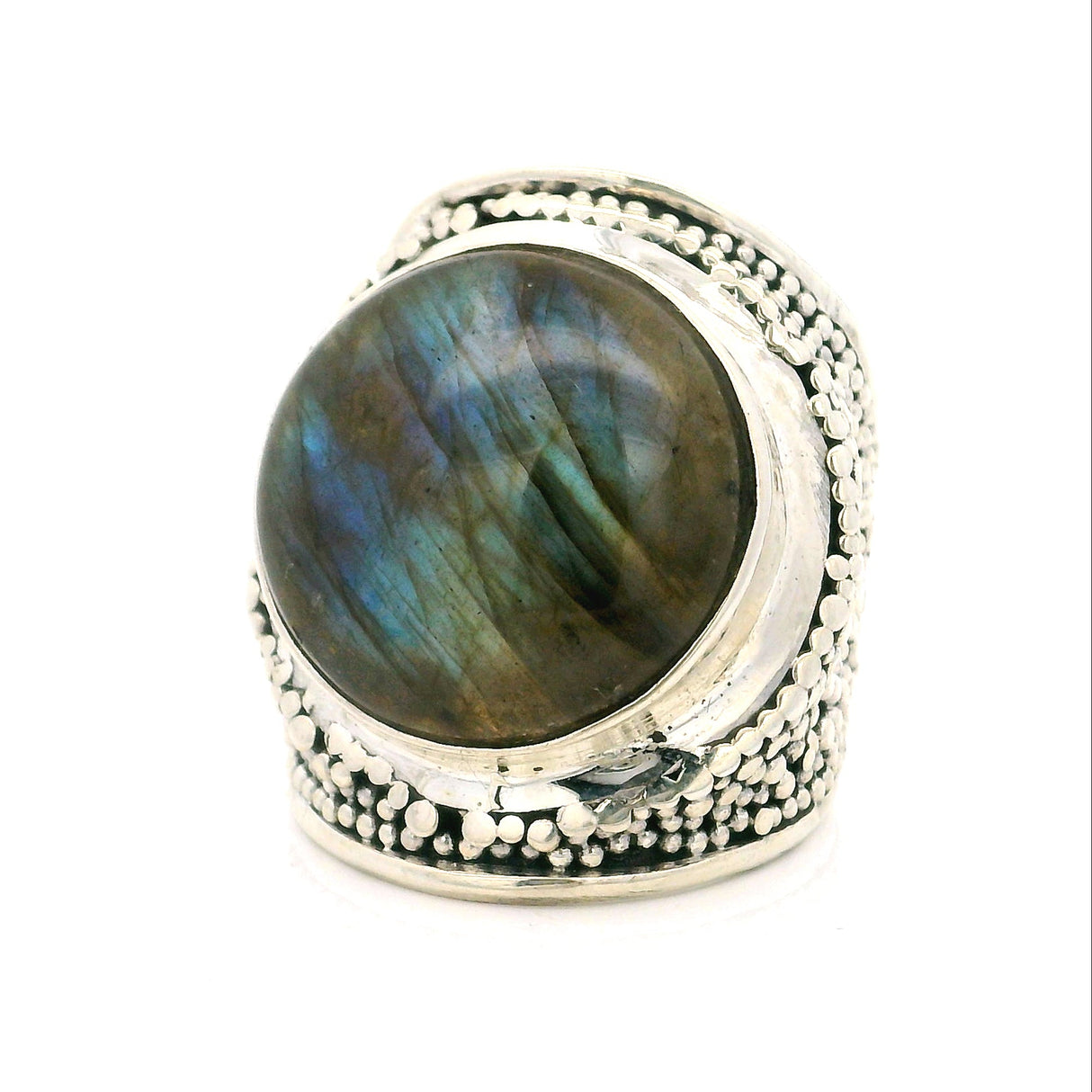 A sterling silver ring featuring a large oval cabochon labradorite gemstone with iridescent blue, green, and brown flashes, set against a plain white background.