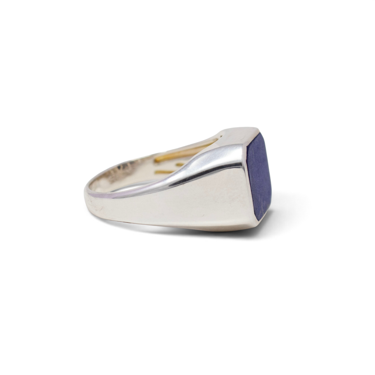 Side view of the lapis lazuli sterling silver signet ring showing its tapered polished band