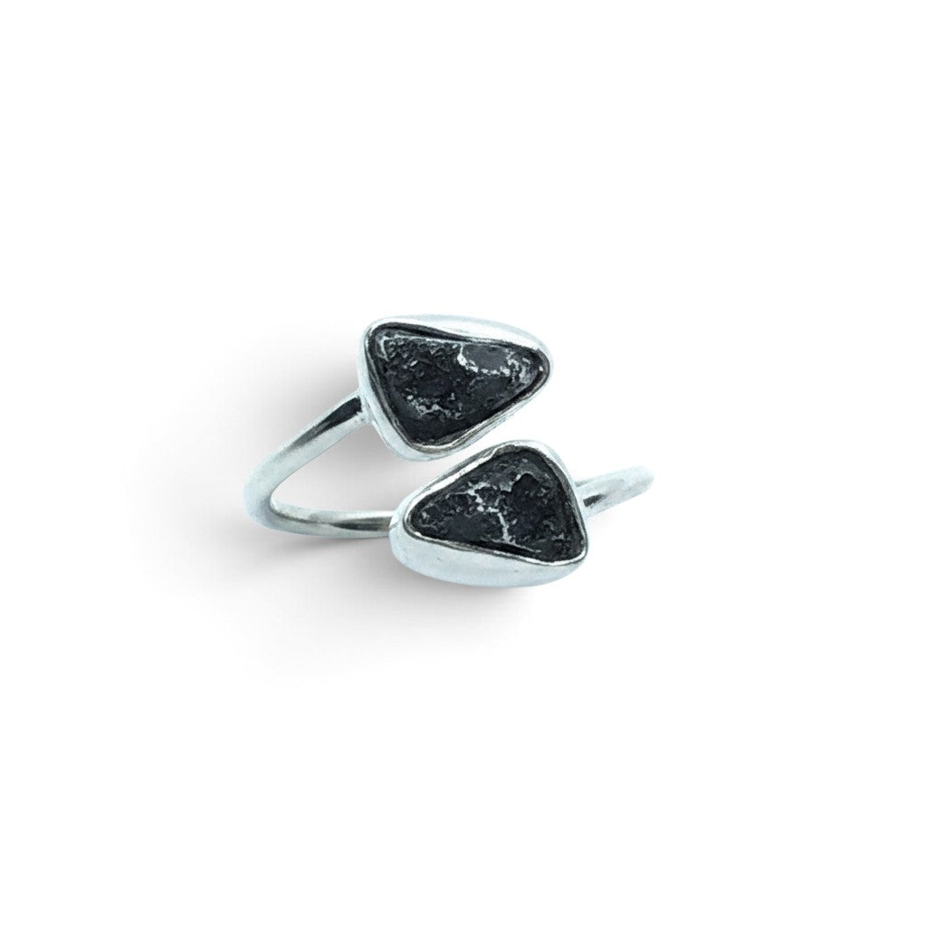 Rare Earth Gallery Agoudal meteorite ring featuring two bezel-set black cosmic nuggets on a polished silver open band.
