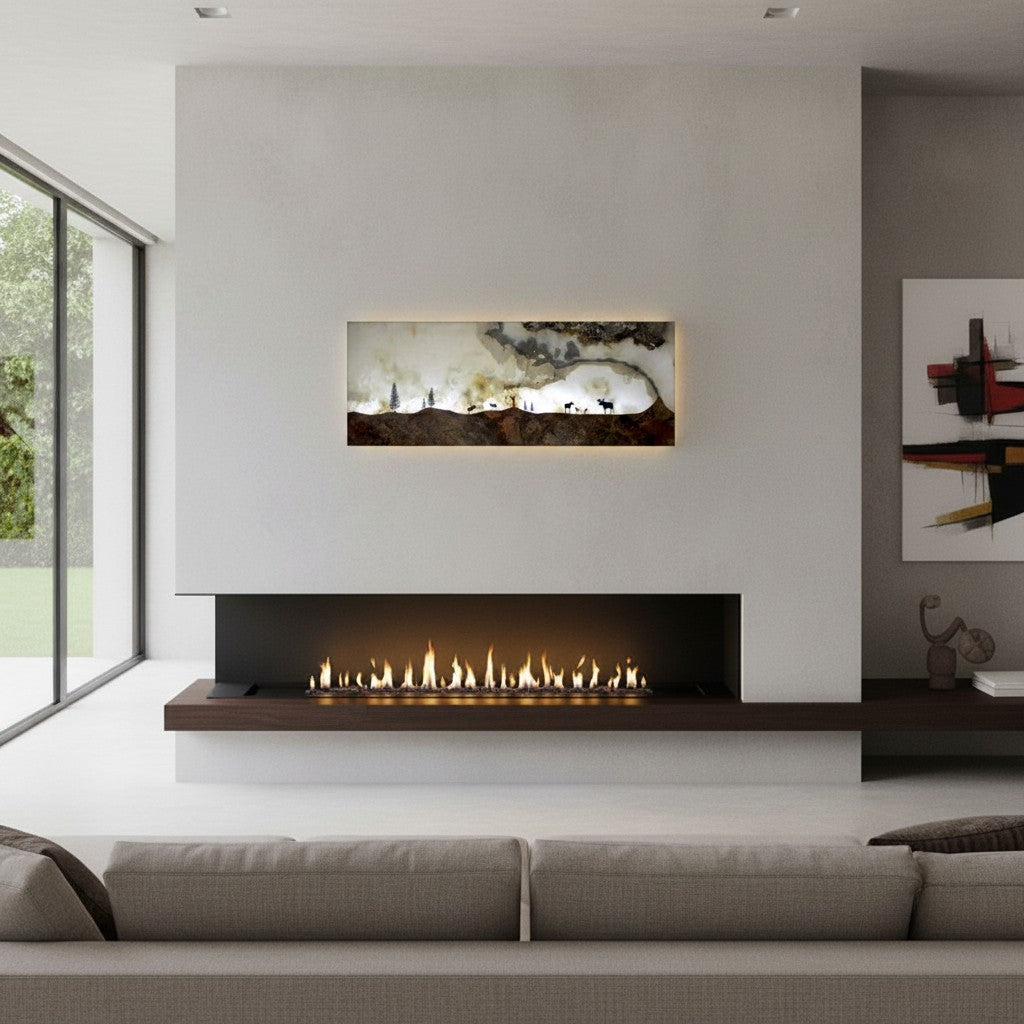 Rare Earth Gallery illuminated onyx and travertine panel with moose silhouettes and trees on a rocky landscape, amber lighting.