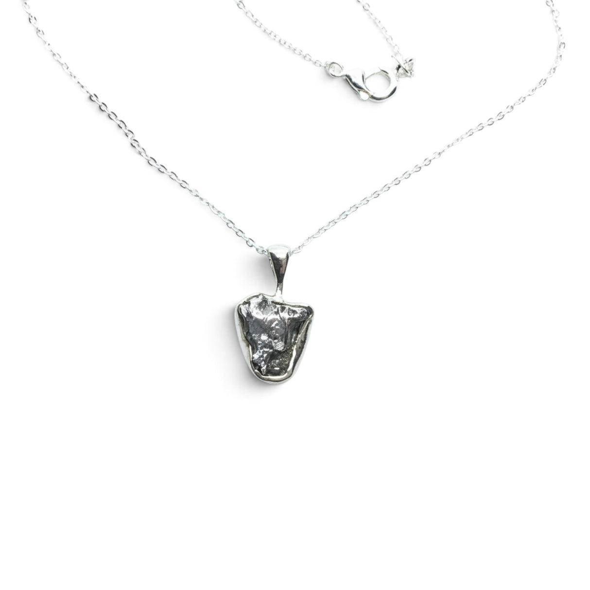 Rare Earth Gallery Campo De Cielo meteorite nugget pendant in a 925 sterling silver bezel on an 18-inch chain