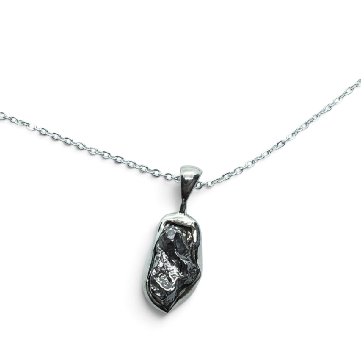 Rare Earth Gallery Campo De Cielo meteorite nugget pendant in a 925 sterling silver bezel on an 18-inch chain