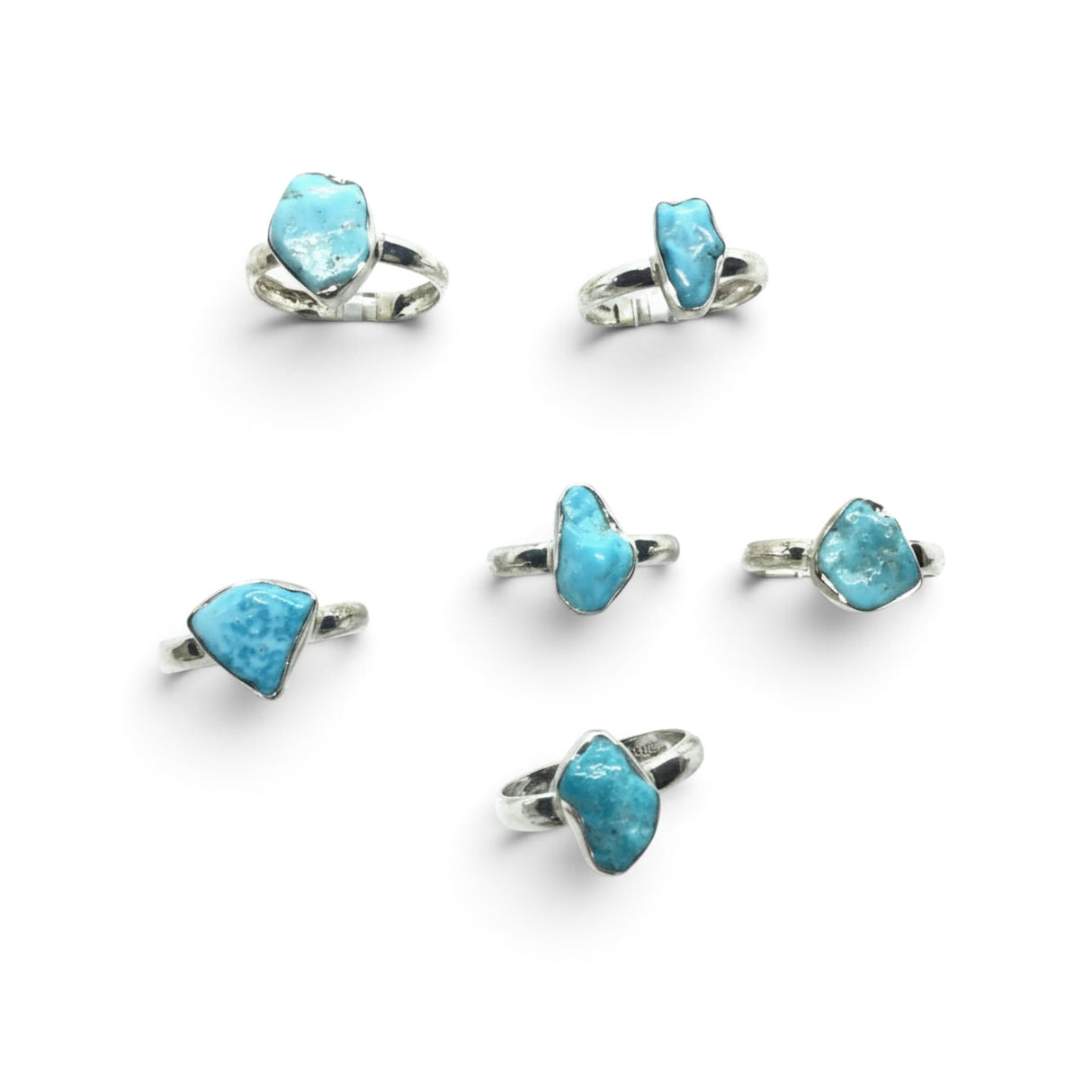 Rare Earth Gallery collection of polished freeform turquoise nugget rings set in simple 925 sterling silver bands.