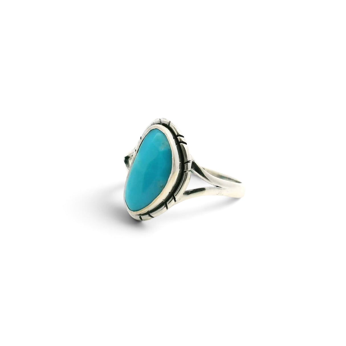Rare Earth Gallery New Mexican turquoise ring with a faceted rounded triangle stone in a stamped sterling silver band