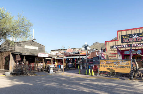 Rustic wooden buildings of Frontier Town, a historic attraction in Cave Creek AZ near Rare Earth Gallery