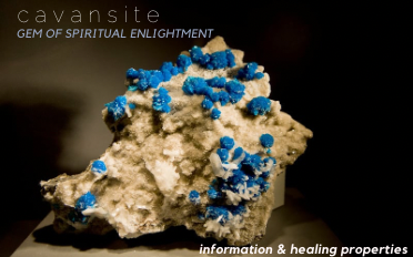 Cavansite, gem of spiritual enlightenment — bright blue crystal clusters on a pale rock matrix