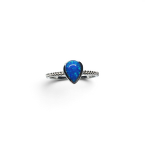 Rare Earth Gallery pear-shaped blue opal ring featuring a delicate textured metal band on a white background.