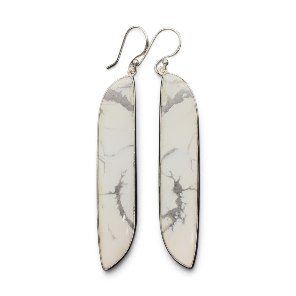 Rare Earth Gallery elongated howlite dangle earrings featuring freeform white cabochons in 925 sterling silver bezels.