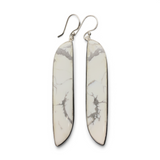 Rare Earth Gallery elongated howlite dangle earrings featuring freeform white cabochons in 925 sterling silver bezels.