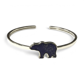 Rare Earth Gallery lapis lazuli twist bangle bracelet featuring a grizzly bear inlay with a polished silver bezel.